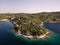 Drone flight near The Island of Kolochep, Croatia. Yachts moored in sea, the coast of the island in the Adriatic Sea