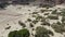 Drone flight over mountain range and dry riverbed in Kaokoveld in norther Namibia