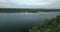 Drone flight over the river overlooking the tug barge and sailboat in the evening, sunset. Ukraine