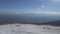 Drone Flight over a Snowy Alpine forest