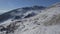 Drone Flight over a Snowy mountains