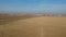 Drone flight panoramic view of autumn fields, forests, highway and cars