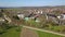 Drone flight towards the empty thermal bath in Beuren on the Swabian Alps, Germany on a sunny day