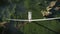 Drone flight towards maintenance workers on top of a Wind Turbine, 4K