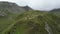 Drone flight towards male hiker (man) with mountain panorama in Texel group, South Tyrol, Italy