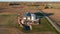 Drone fly above farm grain dryer and rural road, aerial