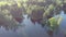 Drone fly above lake landscape with trees in spring time