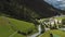 Drone flying above amazing mountain river stream and camping site on foot of mountain in Engelberg, Switzerland Alps.