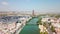 Drone flying above the famous Guadalquivir River in the center of Seville City