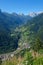 DRONE: Flying above a quiet village in the breathtaking Dolomites on a sunny day