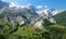 DRONE: Flying across the forest covered valley and towards spectacular glacier.