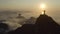 Drone flying away from the statue of Christ the Redeemer during sunrise