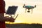 Drone flying. copter pilotage at sunset