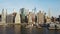 Drone flying low over the East river and pier. Aerial view of the Manhattan busy district in New York, America.