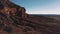 Drone flying next to massive cliffs and rocks in Arizona, incredible endless vast open spaces of sunny desert skyline.