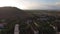 Drone flying over the Belle Etoile town in Mauritius, close to Port Louis. Stormy Sky and mountain in Background