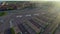 Drone flying over parking, checking free places at outlet village Mantova, Italy
