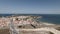 Drone flying over Peniche coastal village in Portugal. Aerial forward