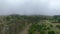 Drone flying over railway line with mist covering background