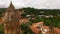 Drone flying over St George church and houses of Signagi town in Georgia