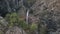 Drone is flying to picturesque waterfall in mountain, top view