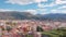 Drone is flying up over amazing italian comune Sestri Levante in sunny summer day, showing city panorama