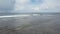 Drone flyover view of waves in a surfing place in the Philippines.