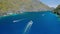 Drone follow Island hopping boats in strait between Matinloc and Tapiutan Island in El Nido, Palawan, Philippines