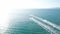 A drone follows a jet ski company into the sea