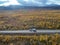 drone footage Car Camping Caravan driving road lake Swedish Lapland Sunny fall colors Abisko National Park Sweden