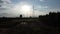 Drone footage of electric poles and wires in the sky at sunset in the countryside. Silhouette of electric pole at dusk.