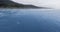 Drone footage of gray whale releasing fountain in shallow water Ruby Beach, Olympic National Park, Washington, USA