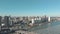 Drone footage of a slow right pan of the city of Rotterdam, Netherlands and it\\\'s water channel on a sunny day.