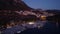 Drone footage of touristic Kas town in Turkey with houses on the mountain at summer evening