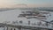 Drone footage of winter view of St. Petersburg at sunset, frozen Neva river, steam over city, Peter and Paul fortress