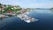 Drone, harbor and boat in ocean with landscape, scenery and nature background for location or holiday. Aerial view