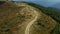 Drone hilly forest path to peak peaceful touristic national park sunny day