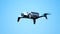 Drone hovering or flying clear blue sky