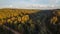 Drone image. aerial view of rural area with gravel road in autumn colored fields and forests. latvia