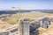 Drone image of city construction site with yellow industrial tower crane