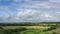 drone-image of a North German landscape with thick clouds in the sky in fast motion3