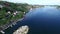 Drone, lake and town in nature by port, peace and tranquil harbour for travel, water and island. Overhead, river and