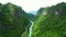 Drone, landscape and mountain with road in forest for environment, countryside wilderness and trees. Travel, river and