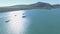 Drone, landscape and mountains with boats in ocean bay for sailing, exotic and summer vacation. Nature, island and