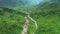 Drone, landscape and nature with road in forest for environment, countryside wilderness and trees. Travel, river and