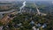 Drone landscape shots of ancient Chernihiv town with trees, river and buildings