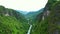 Drone, landscape and travel with road in forest for environment, countryside wildernesses and trees. Nature, river and
