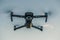 Drone like Mavic 2 Pro flying during sunset