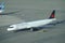 DRONE: Modern Air Canada airplane taxis past the airport on sunny spring day.