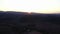 Drone, mountain and environment at sunset in summer for sustainability or eco friendly conservation. Earth, nature or